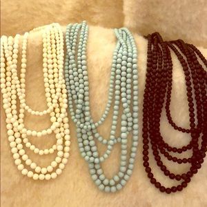 Multi-layered beaded necklaces